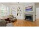 Cozy living room with a fireplace, built-in bookshelves, and comfortable seating at 5119 Greythorne Ln, Marietta, GA 30068