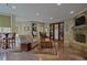Open living room with a stone fireplace, comfortable seating, and a dining area, creating a cozy and inviting atmosphere at 5119 Greythorne Ln, Marietta, GA 30068