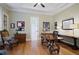 Inviting home office with hardwood floors, a ceiling fan, custom trim and classic furnishings at 5119 Greythorne Ln, Marietta, GA 30068