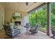 Cozy outdoor patio with a fireplace and comfortable seating, perfect for relaxing or entertaining guests at 5119 Greythorne Ln, Marietta, GA 30068