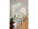 Elegant staircase with a curved design, wrought iron railings, and bright natural light from surrounding windows at 5119 Greythorne Ln, Marietta, GA 30068