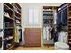 Organized walk-in closet featuring custom shelving, drawers, and ample storage space for clothes and accessories at 5119 Greythorne Ln, Marietta, GA 30068