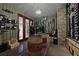 Custom wine cellar with extensive bottle storage, barrel accents, and ambient lighting, perfect for entertaining guests at 5119 Greythorne Ln, Marietta, GA 30068