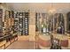 A fully stocked wine cellar featuring climate control, custom racking, and display areas for the wine connoisseur at 5119 Greythorne Ln, Marietta, GA 30068