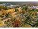 Captivating aerial view of a home nestled amidst lush trees and foliage, with a shopping center nearby at 1377 Dorothy Dr, Decatur, GA 30030