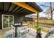 Inviting covered back porch with modern outdoor furniture and stylish decor provides a relaxing space at 1377 Dorothy Dr, Decatur, GA 30030