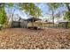 Backyard with deck, wooden fence, and leafy trees for a private and relaxing space at 1377 Dorothy Dr, Decatur, GA 30030