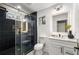 Modern bathroom with black tile shower, glass doors, and modern vanity at 1377 Dorothy Dr, Decatur, GA 30030