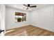 Bedroom with view to backyard, hardwood floor, ceiling fan, and natural light at 1377 Dorothy Dr, Decatur, GA 30030
