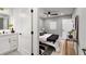 Modern bedroom featuring hardwood floors, neutral walls, modern ceiling fan and ensuite bath at 1377 Dorothy Dr, Decatur, GA 30030