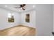 Sunlit bedroom with two windows and light hardwood floors at 1377 Dorothy Dr, Decatur, GA 30030