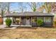 Charming home with brick accents, new grey siding, and covered front porch at 1377 Dorothy Dr, Decatur, GA 30030