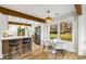 A bright kitchen with a breakfast bar, pendant lighting, hardwood floors and an adjacent breakfast nook at 1377 Dorothy Dr, Decatur, GA 30030