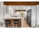 Modern kitchen featuring stainless steel appliances, granite countertops, and an island with seating at 1377 Dorothy Dr, Decatur, GA 30030