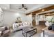 Bright and airy living room open to kitchen, featuring hardwood floors, ceiling fan and large windows at 1377 Dorothy Dr, Decatur, GA 30030