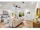 A bright living room with hardwood floors, tray ceiling and a modern ceiling fan at 1377 Dorothy Dr, Decatur, GA 30030
