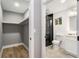Bright walk-in closet with hardwood floors adjoins bathroom with glass-door shower at 1377 Dorothy Dr, Decatur, GA 30030