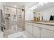 Bathroom featuring large glass shower and double vanity at 2237 Foley Park St, Snellville, GA 30078