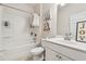 Bathroom with white vanity and bath with shower at 2237 Foley Park St, Snellville, GA 30078