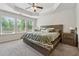 Bright bedroom with large windows and tray ceiling at 2237 Foley Park St, Snellville, GA 30078