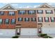 Charming townhomes with brick facades, attached garages, and professionally maintained landscaping at 2237 Foley Park St, Snellville, GA 30078