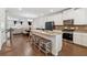 Open concept kitchen with stainless appliances, granite countertops, and breakfast bar at 2237 Foley Park St, Snellville, GA 30078