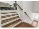 Beautiful staircase with wood and white accents at 2237 Foley Park St, Snellville, GA 30078