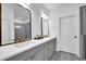 Elegant bathroom featuring a dual sink vanity, modern fixtures, and a glass-enclosed shower for a spa-like experience at 5320 Coltman Dr, Cumming, GA 30028