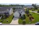 Beautifully landscaped home with a well-maintained lawn, concrete driveway, and attached two-car garage at 5320 Coltman Dr, Cumming, GA 30028
