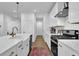 Beautiful kitchen showcasing a large island, stainless steel appliances, white cabinets, and elegant gold hardware at 5320 Coltman Dr, Cumming, GA 30028