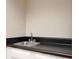 This bar features a black counter top and white cabinetry at 5474 Post Road Pass, Stone Mountain, GA 30088