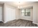 Light-filled dining room with wood floors and a large window view at 5474 Post Road Pass, Stone Mountain, GA 30088
