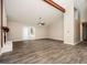 Bright, open living room with hardwood floors, vaulted ceiling, and a charming fireplace at 5474 Post Road Pass, Stone Mountain, GA 30088