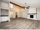 Large living room with a wet bar, hardwood floors, fireplace, and a vaulted ceiling at 5474 Post Road Pass, Stone Mountain, GA 30088