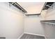 Spacious walk-in closet with shelves and ample storage for an organized wardrobe at 5474 Post Road Pass, Stone Mountain, GA 30088