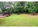 Large, grassy backyard with shade trees and gazebo, great for Gathering fun and entertaining at 60 Valley Rd, Covington, GA 30016