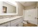 Bathroom features granite countertop vanity and a shower-tub combination at 60 Valley Rd, Covington, GA 30016