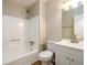 Well-lit bathroom features a shower-tub combo, vanity with ample storage, and neutral walls at 60 Valley Rd, Covington, GA 30016