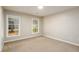 Bright, carpeted bedroom with two windows and ample natural light at 60 Valley Rd, Covington, GA 30016