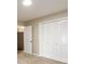 Bedroom featuring carpet, white closet doors, and overhead lighting at 60 Valley Rd, Covington, GA 30016