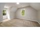 Bright bedroom featuring natural light, neutral walls, plush carpet, and ample space at 60 Valley Rd, Covington, GA 30016