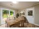 Inviting dining room with wood table, rug, and access to outdoor patio at 60 Valley Rd, Covington, GA 30016