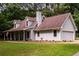 Charming gray home with a two-car garage, dormer windows, and well-maintained lawn at 60 Valley Rd, Covington, GA 30016
