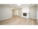 Bright living room with hardwood floors, fireplace, and neutral decor. Ideal for entertaining at 60 Valley Rd, Covington, GA 30016