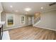 Well-lit living area boasting hardwood floors, modern recessed lighting, and easy access to the staircase at 60 Valley Rd, Covington, GA 30016