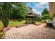 Brick-paved patio with a gazebo and a view of the backyard at 60 Valley Rd, Covington, GA 30016