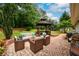Outdoor patio featuring a comfortable seating area, a gazebo, and a lush, green lawn at 60 Valley Rd, Covington, GA 30016