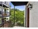 Private balcony offers lush green views, complementing the building's classic design at 1072 Piedmont Ne Ave # 101, Atlanta, GA 30309