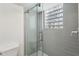 Contemporary bathroom showcases a glass shower enclosure with a unique glass block window at 1072 Piedmont Ne Ave # 101, Atlanta, GA 30309