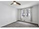 Neutral bedroom featuring ceiling fan, gray carpet, and window at 1072 Piedmont Ne Ave # 101, Atlanta, GA 30309